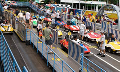 Race cars lined up at the Tomorrowland Speedway ride at the Magic Kingdom.